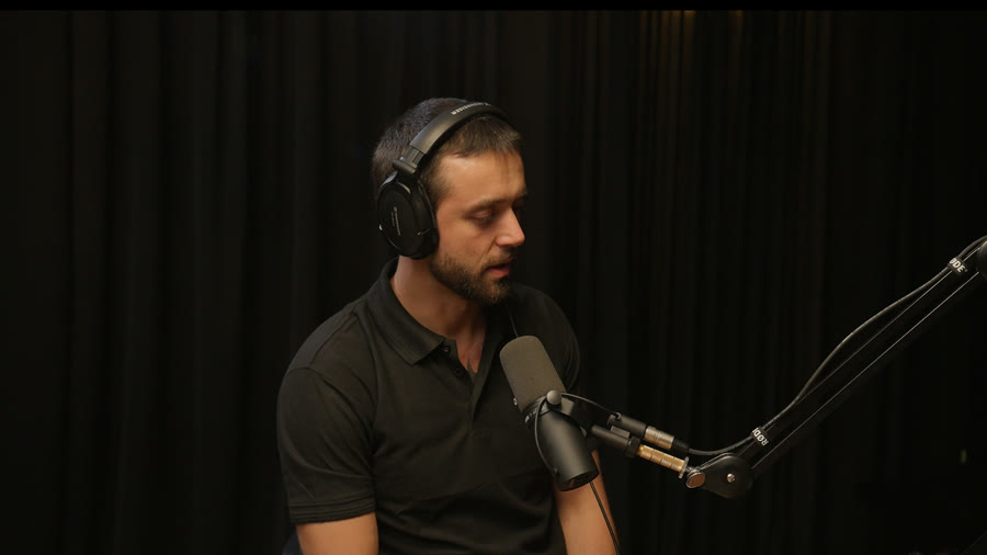 Recording in the studio with a RODE microphone and Sennheiser headphones
